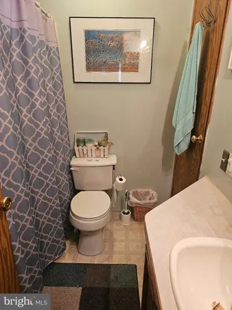 a bathroom with a toilet and a sink