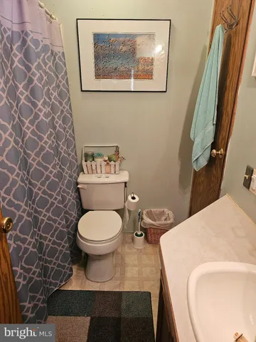 a bathroom with a toilet and a sink