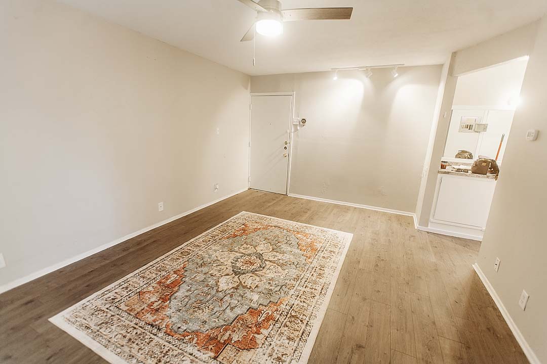 3712 Menchaca Road, Unit 7 Austin, TX 78704 - Photo 7 of 13 Smooth wood-style flooring runs through this versatile main living area with bright track lighting.