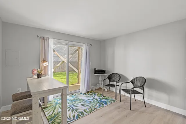a view of a livingroom with furniture and wooden floor