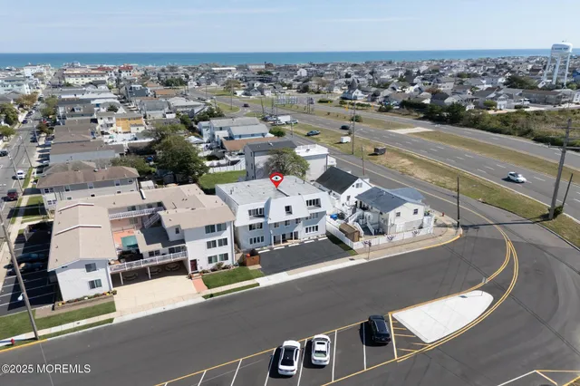 an aerial view of a house with parking space
