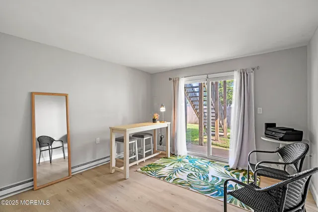 a bedroom with furniture and a window