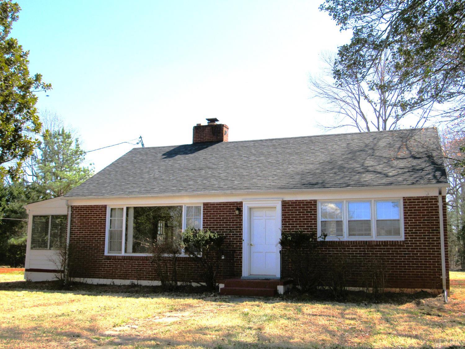 a view of house with yard