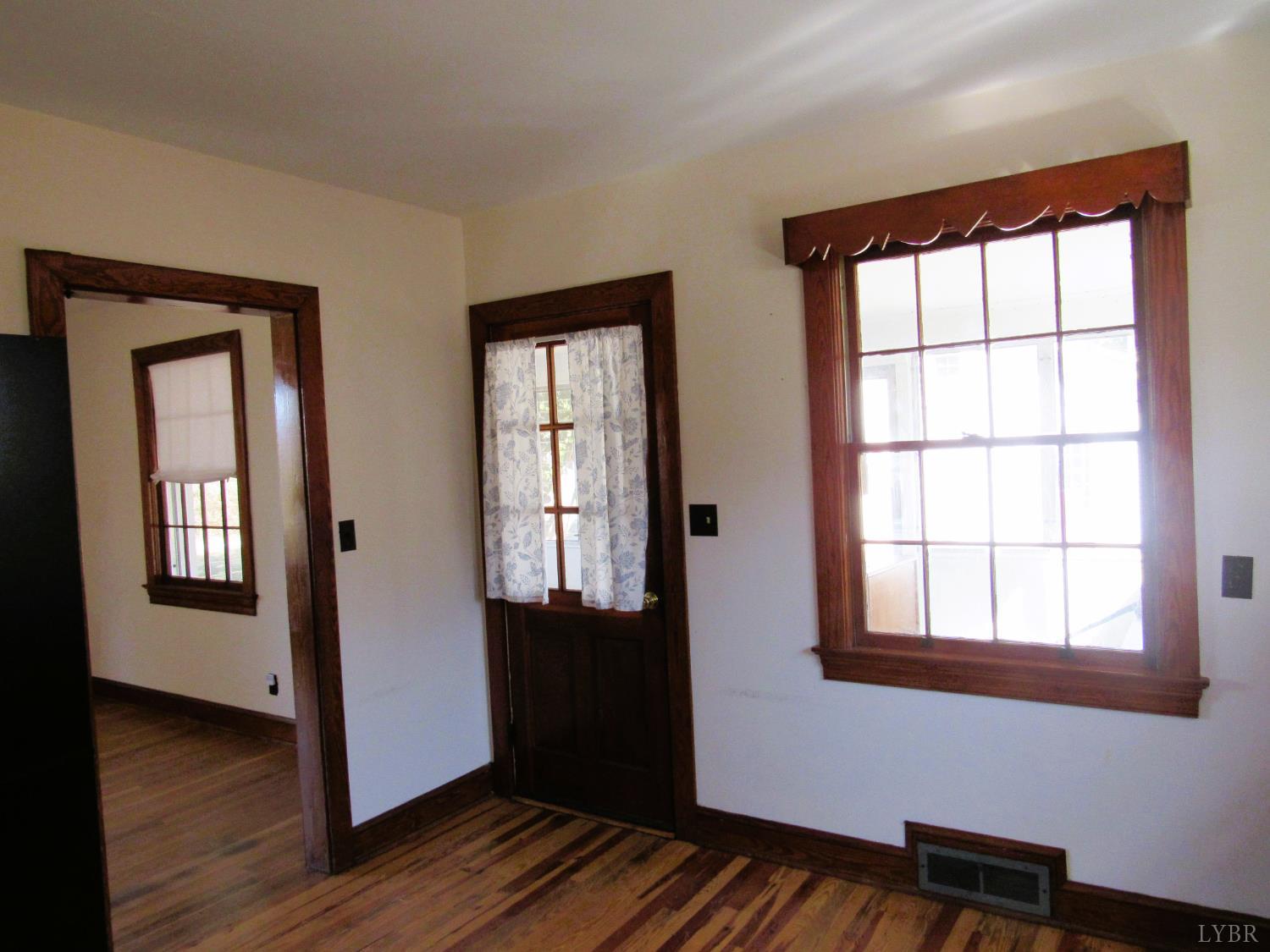 328 Huff Creek Trail Amherst, VA 24521 - Photo 14 of 41 an empty room with wooden floor and windows