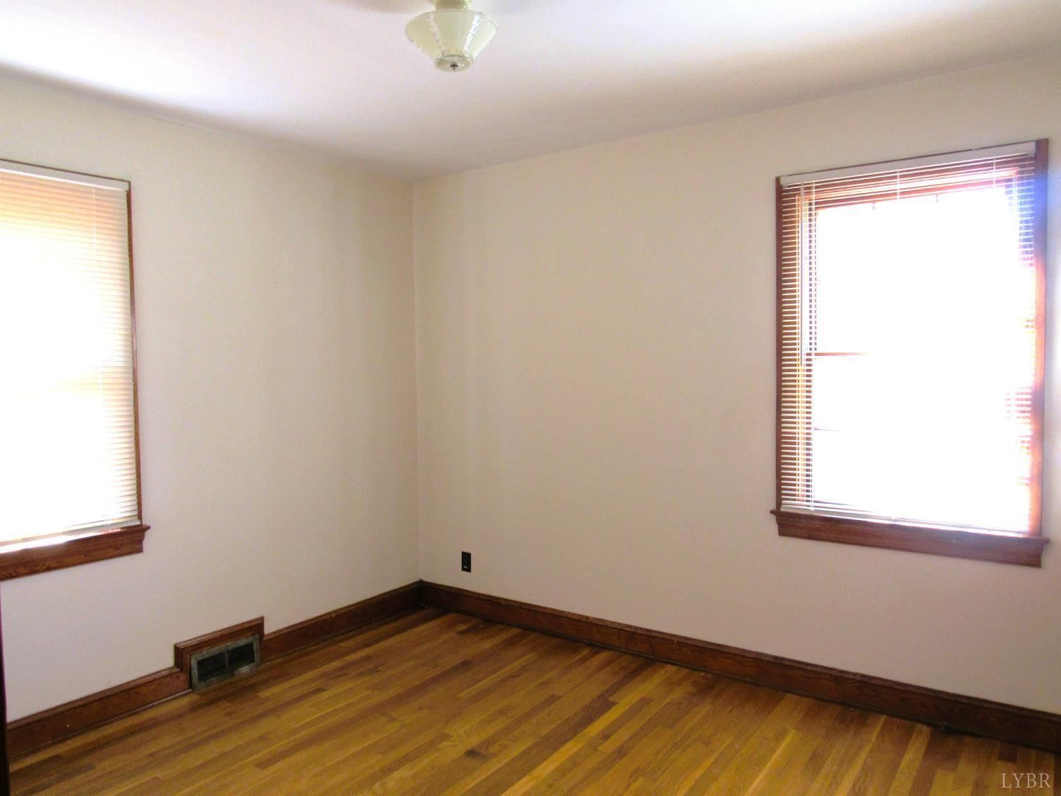 328 Huff Creek Trail Amherst, VA 24521 - Photo 17 of 41 a view of a room with wooden floor and a window