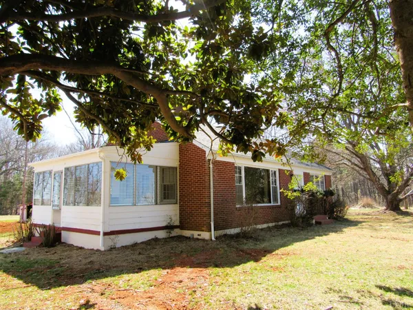 a view of a white house in the background of a house