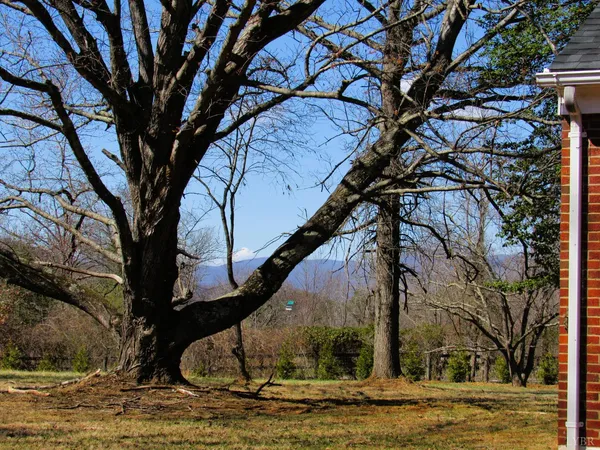an empty room with wooden floor and closet