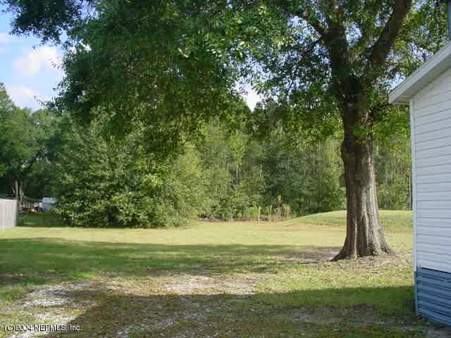 1561 Blair Road South Jacksonville, FL 32221 - Photo 5 of 5 a view of a yard with a tree