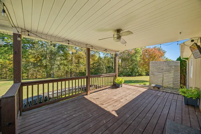 a view of a deck with wooden floor and outdoor space