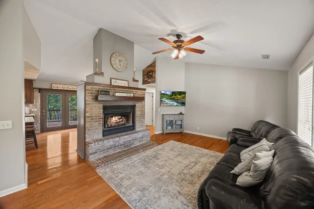 a bedroom with furniture and a fireplace