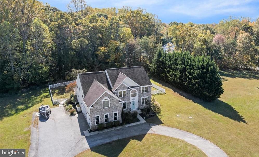 a aerial view of a house with a yard