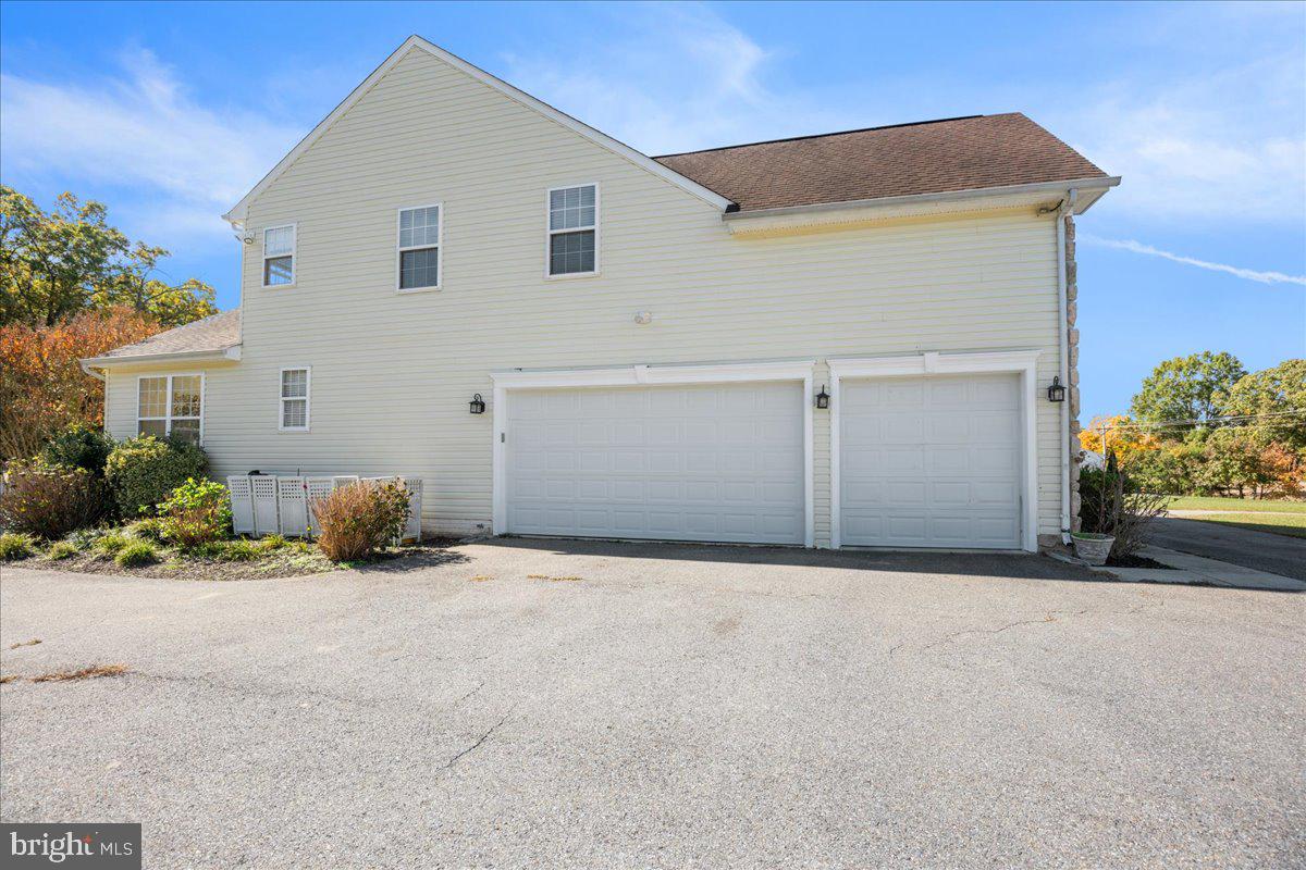 2335 Lowery Road Huntingtown, MD 20639 - Photo 54 of 58 a view of a house with a yard and garage