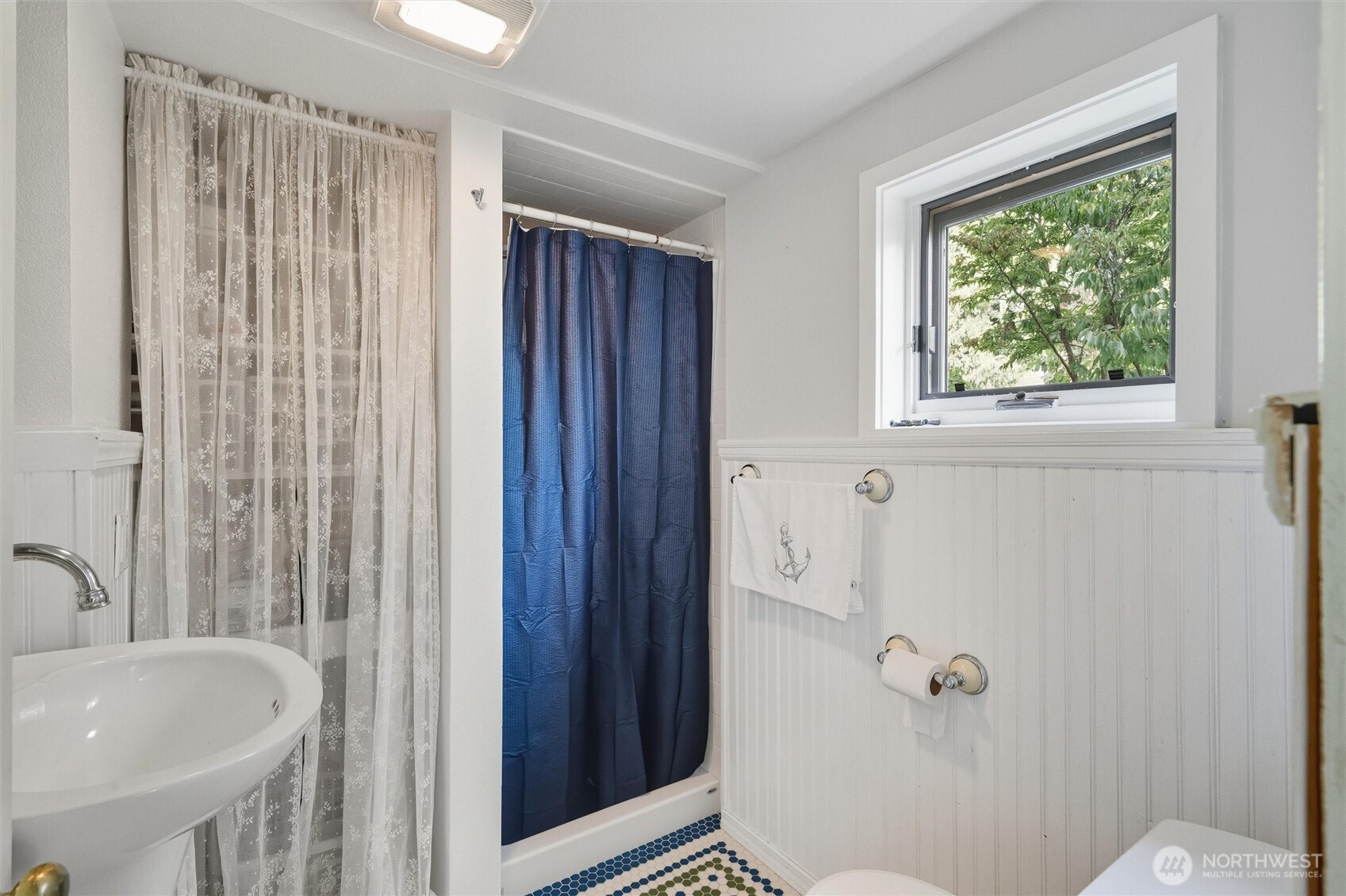 1131 16th Street Bellingham, WA 98225 - Photo 13 of 40 a bathroom with a sink and toilet