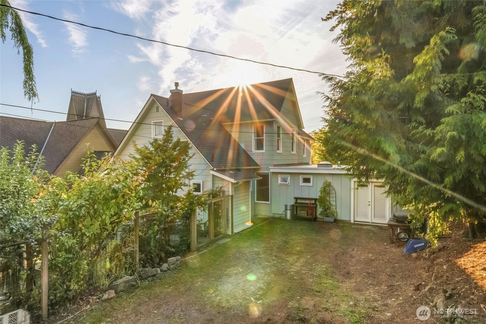 1131 16th Street Bellingham, WA 98225 - Photo 2 of 40 a view of a house with a small yard and wooden fence