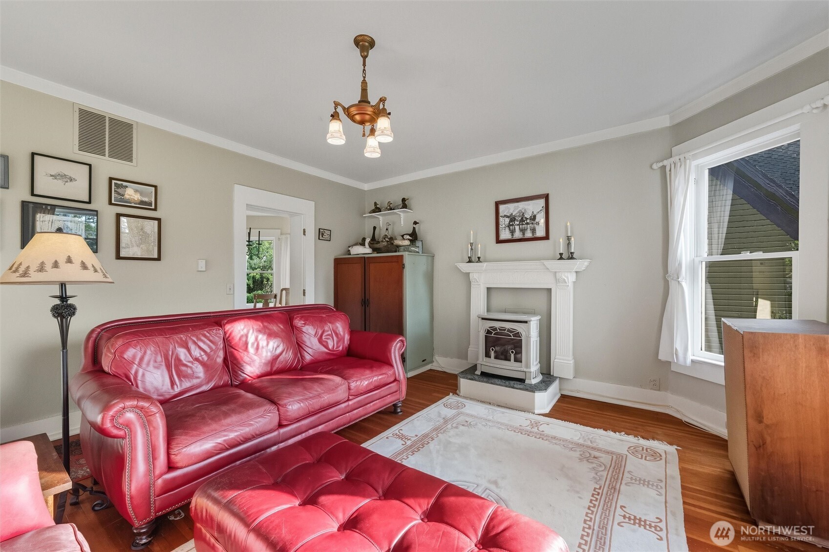 1131 16th Street Bellingham, WA 98225 - Photo 21 of 40 a living room with furniture fireplace and window
