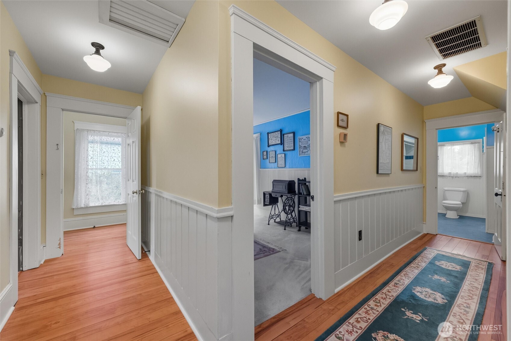 1131 16th Street Bellingham, WA 98225 - Photo 30 of 40 a view of a hallway and a livingroom with wooden floor