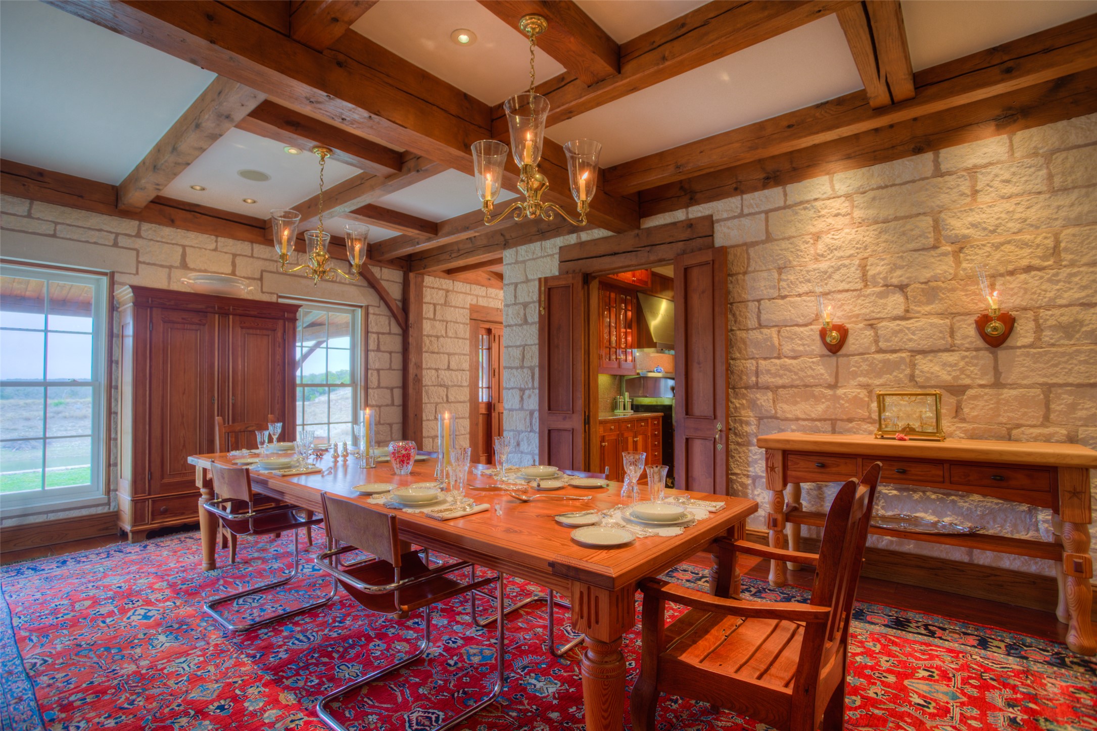 3777 Middle Creek Road Blanco, TX 78606 - Photo 23 of 40 Dining room with hanging lights and coffered ceiling