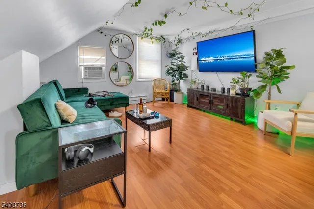 a living room with furniture and a clock