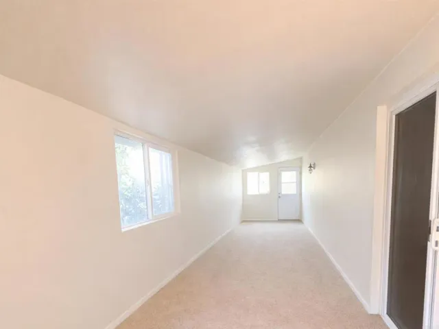 a view of hallway with windows