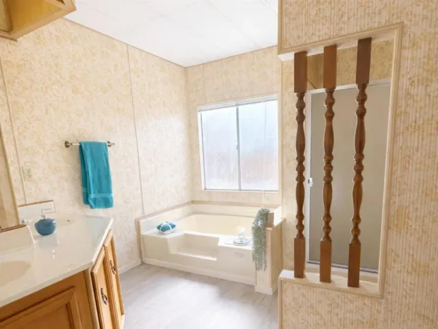 a bathroom with a tub sink and a shower