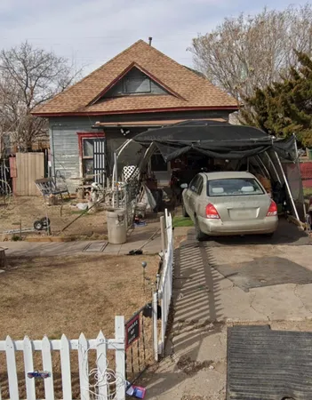 a car parked in front of a house