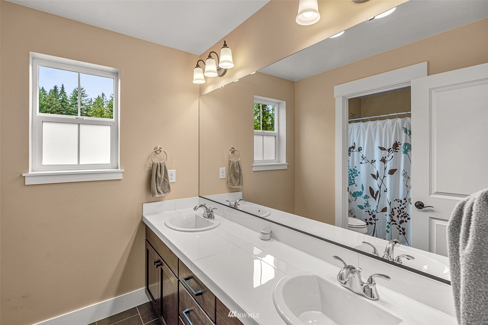 14408 160th Court Southeast Renton, WA 98059 - Photo 21 of 40 a bathroom with a sink and a mirror