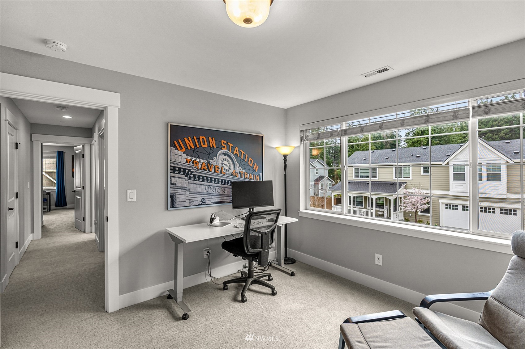 14408 160th Court Southeast Renton, WA 98059 - Photo 24 of 40 a view of a workspace with furniture and a window