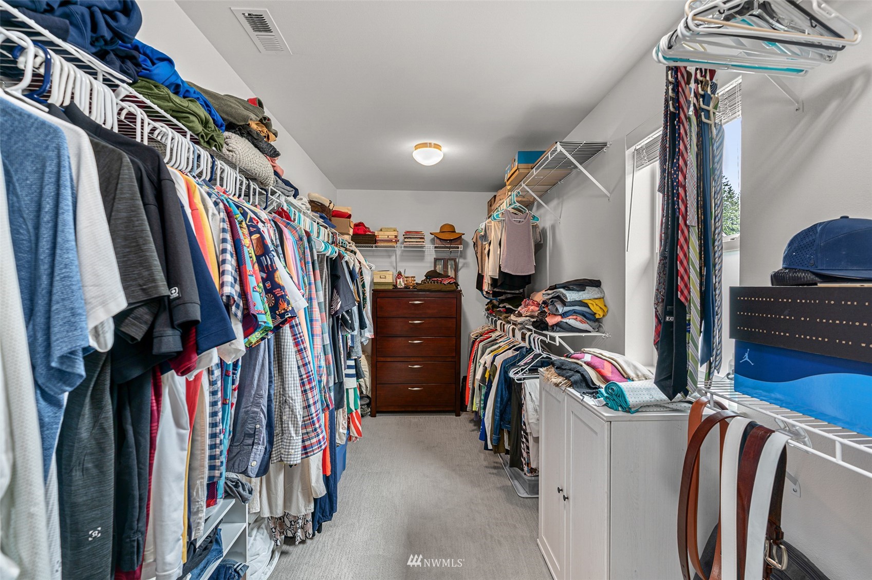 14408 160th Court Southeast Renton, WA 98059 - Photo 32 of 40 a view of walk in closet with clothes