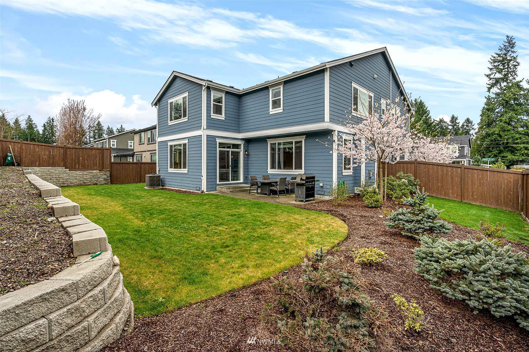 14408 160th Court Southeast Renton, WA 98059 - Photo 35 of 40 a view of a house with backyard and sitting area