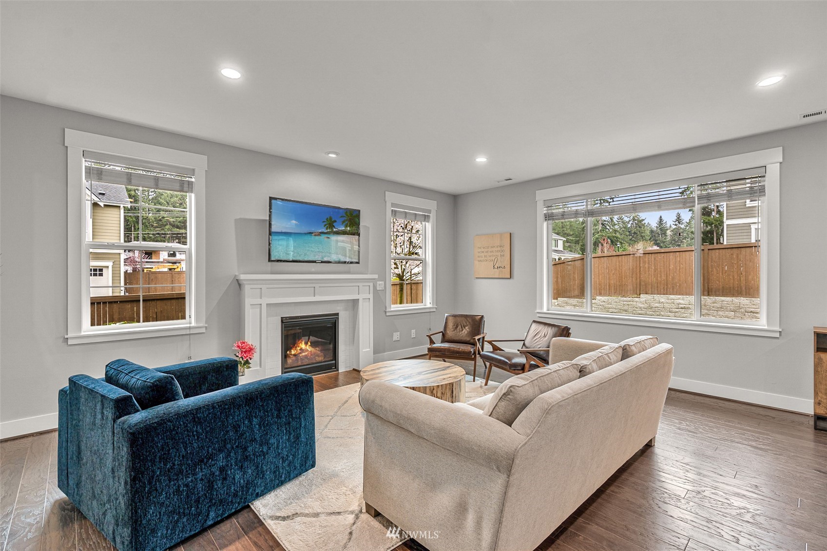 14408 160th Court Southeast Renton, WA 98059 - Photo 5 of 40 a living room with furniture a fireplace and a large window