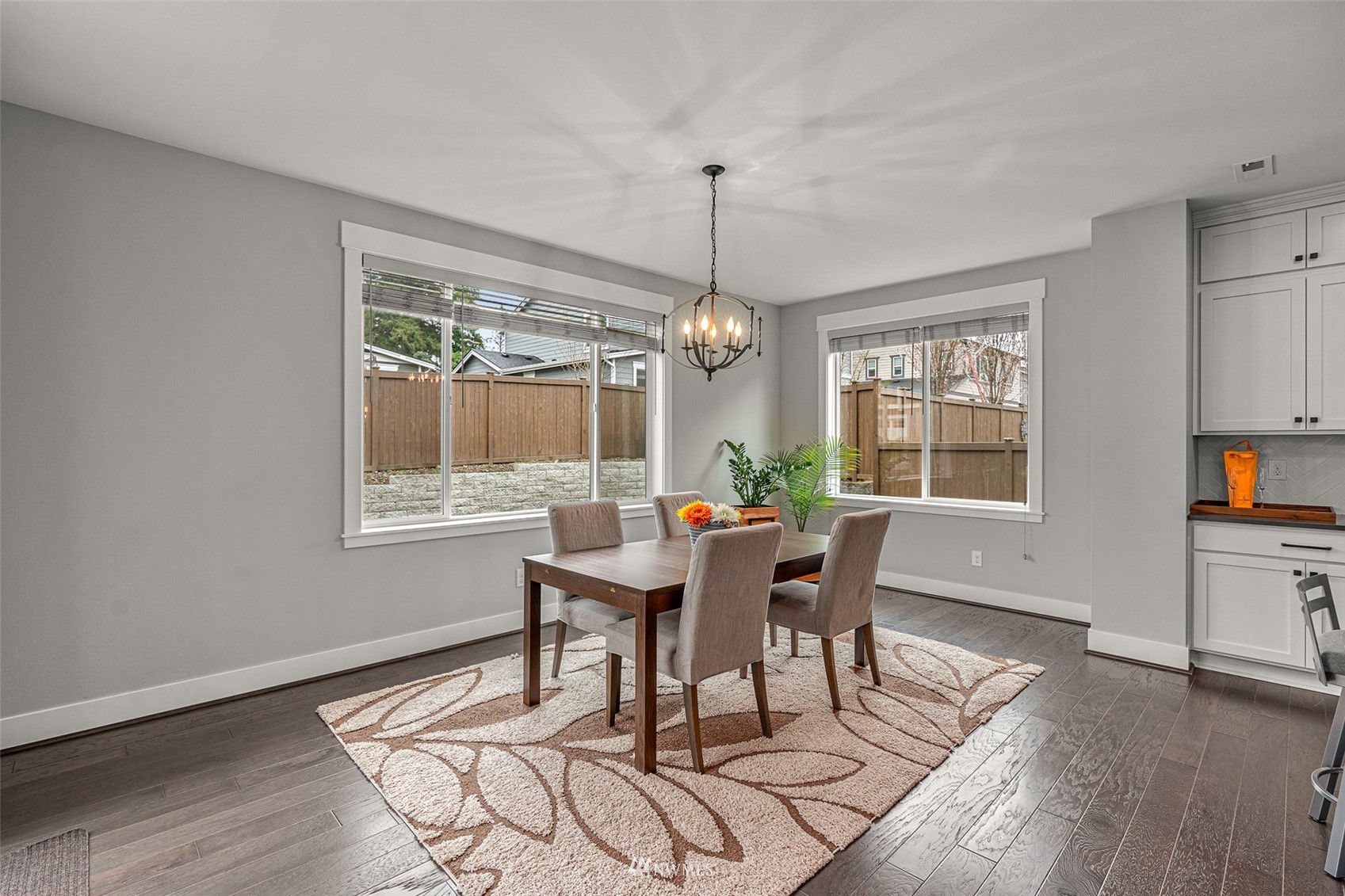 14408 160th Court Southeast Renton, WA 98059 - Photo 7 of 40 a view of a dining room with furniture window and wooden floor