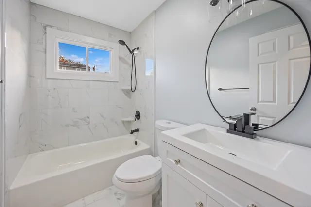 a bathroom with a sink a toilet and a bathtub
