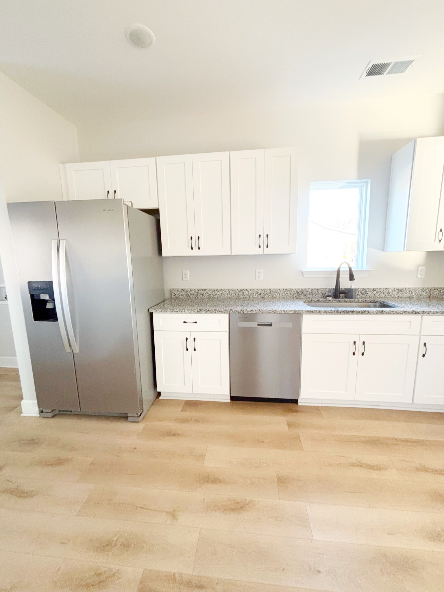 140 Eno Road Dickson, TN 37055 - Photo 3 of 11 a view of a kitchen with granite countertop cabinets and stainless steel appliances