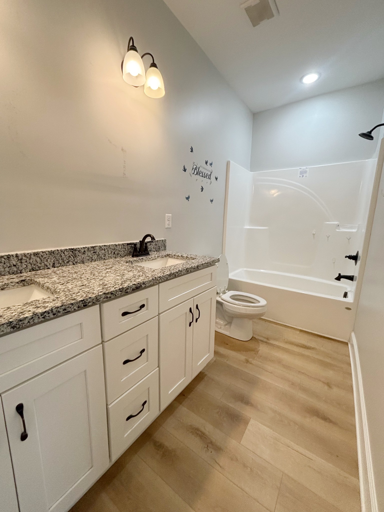 140 Eno Road Dickson, TN 37055 - Photo 8 of 11 a spacious bathroom with double vanity a mirror and a shower