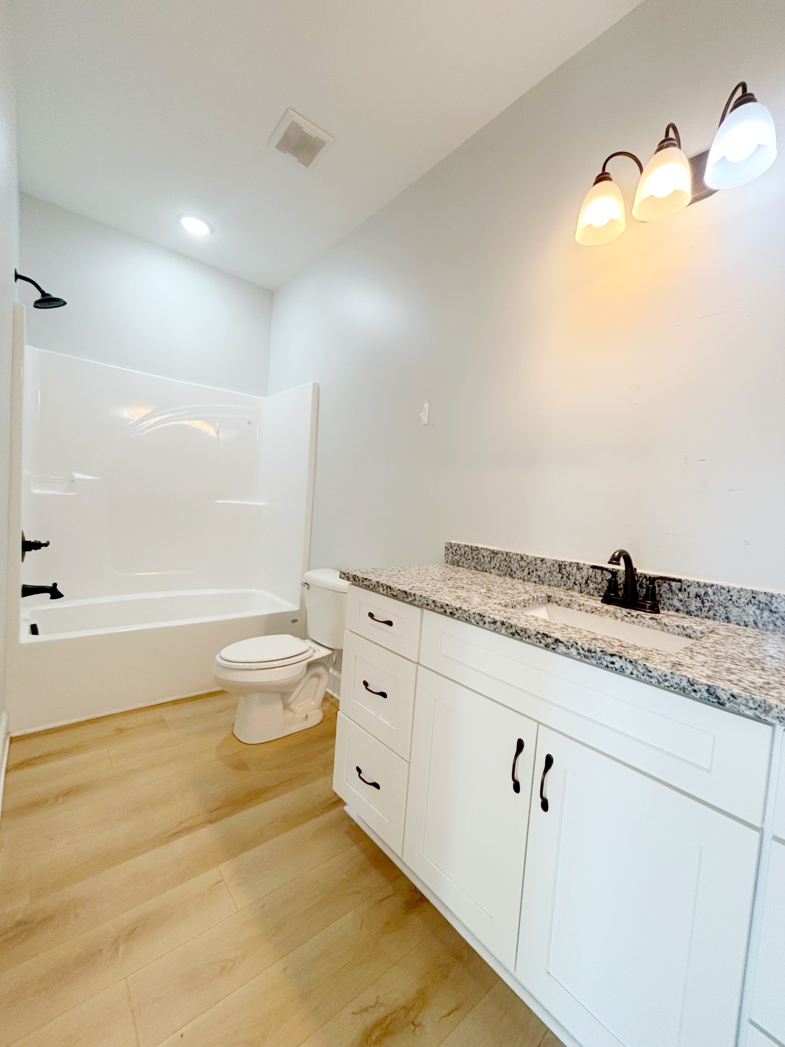 140 Eno Road Dickson, TN 37055 - Photo 9 of 11 a bathroom with a granite countertop sink mirror vanity and toilet