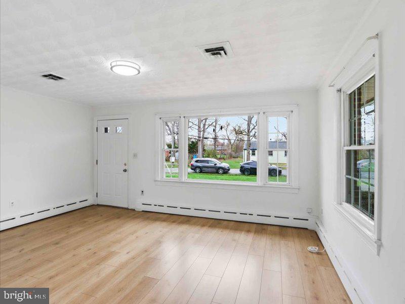 6404 Inwood Drive Springfield, VA 22150 - Photo 12 of 41 wooden floor in an empty room with a window