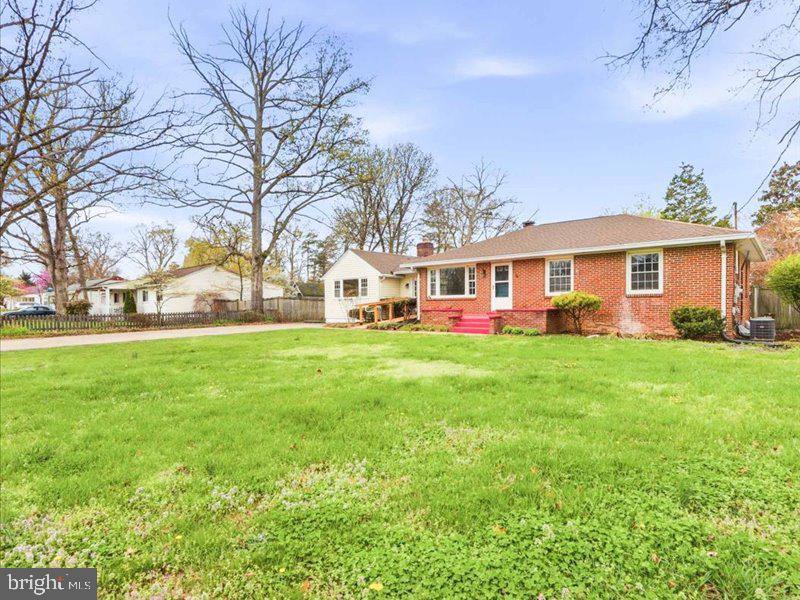 6404 Inwood Drive Springfield, VA 22150 - Photo 2 of 41 a view of house with a big yard and large trees
