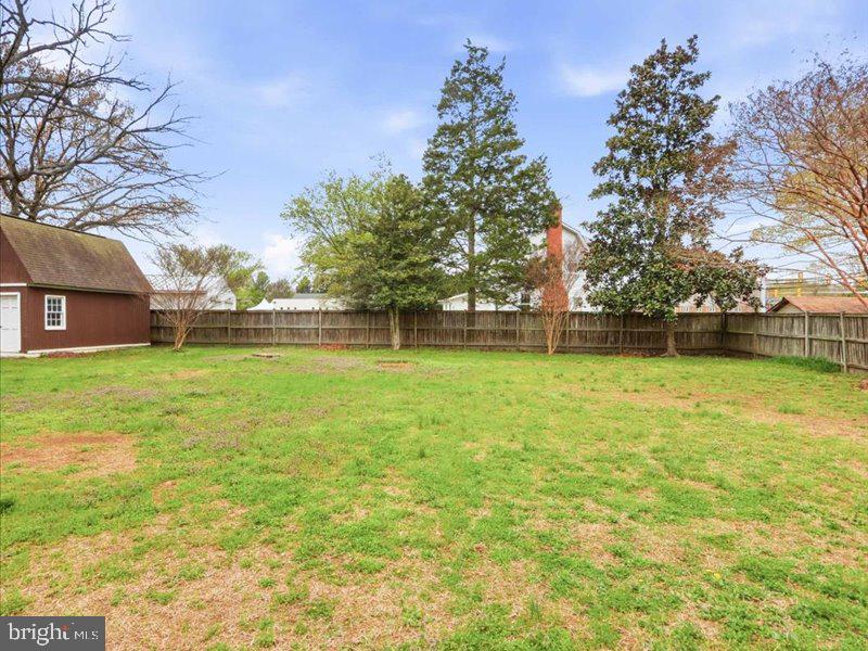 6404 Inwood Drive Springfield, VA 22150 - Photo 35 of 41 a view of outdoor space with swimming pool and green space