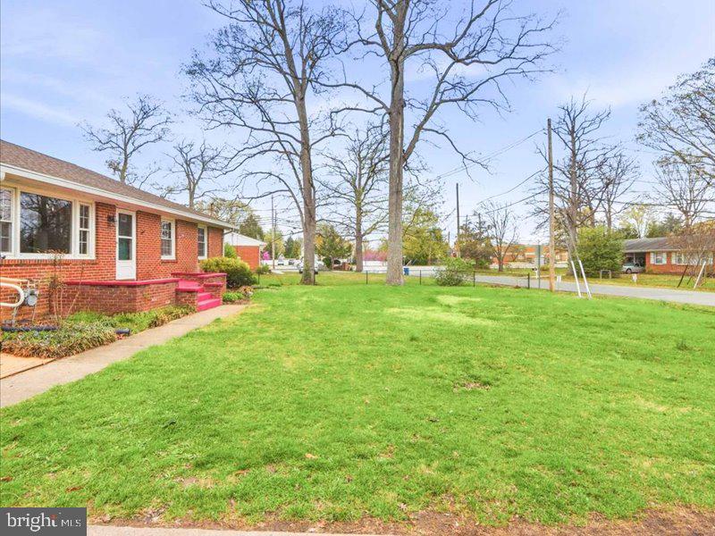 6404 Inwood Drive Springfield, VA 22150 - Photo 4 of 41 a backyard of a house with outdoor seating