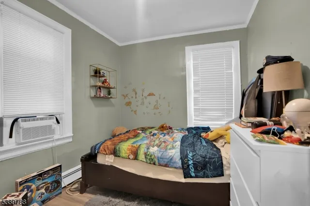 a bedroom with a bed and dresser