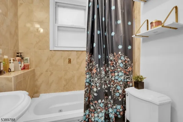 a bathroom with a bathtub and shower