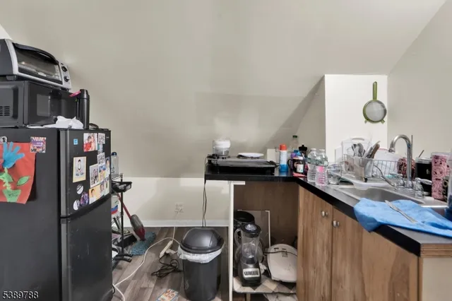 a kitchen with a sink cabinets and appliances