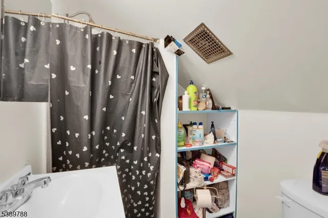 a view of a house with a yard and garage