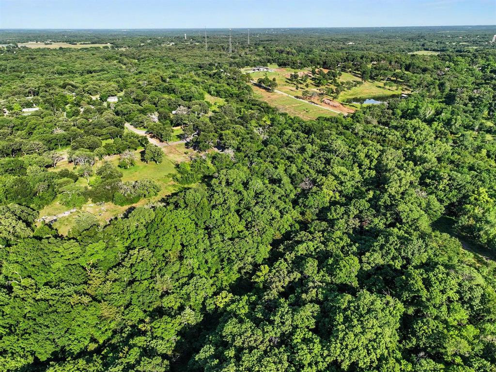 830 East Morgan Street Denison, TX 75021 - Photo 7 of 8 an aerial view of residential houses with outdoor space and trees