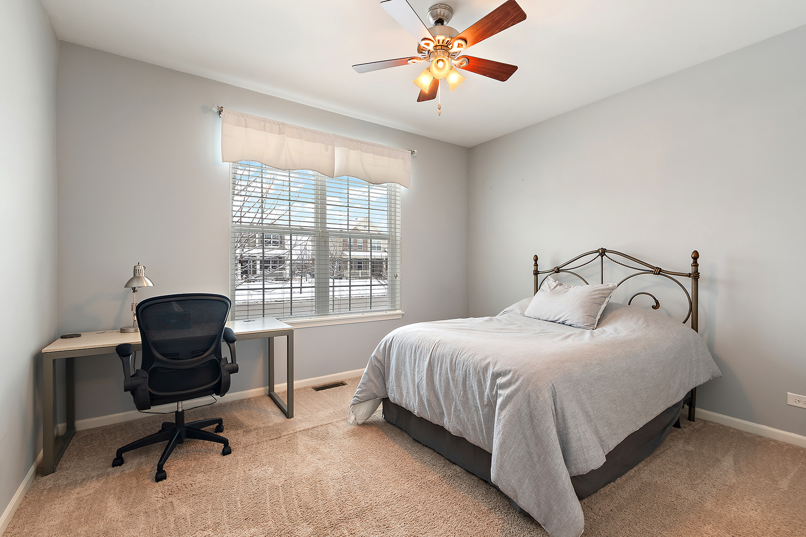 2073 Rownham Hill Road New Lenox, IL 60451 - Photo 18 of 34 a bedroom with a bed a desk and chair with a window