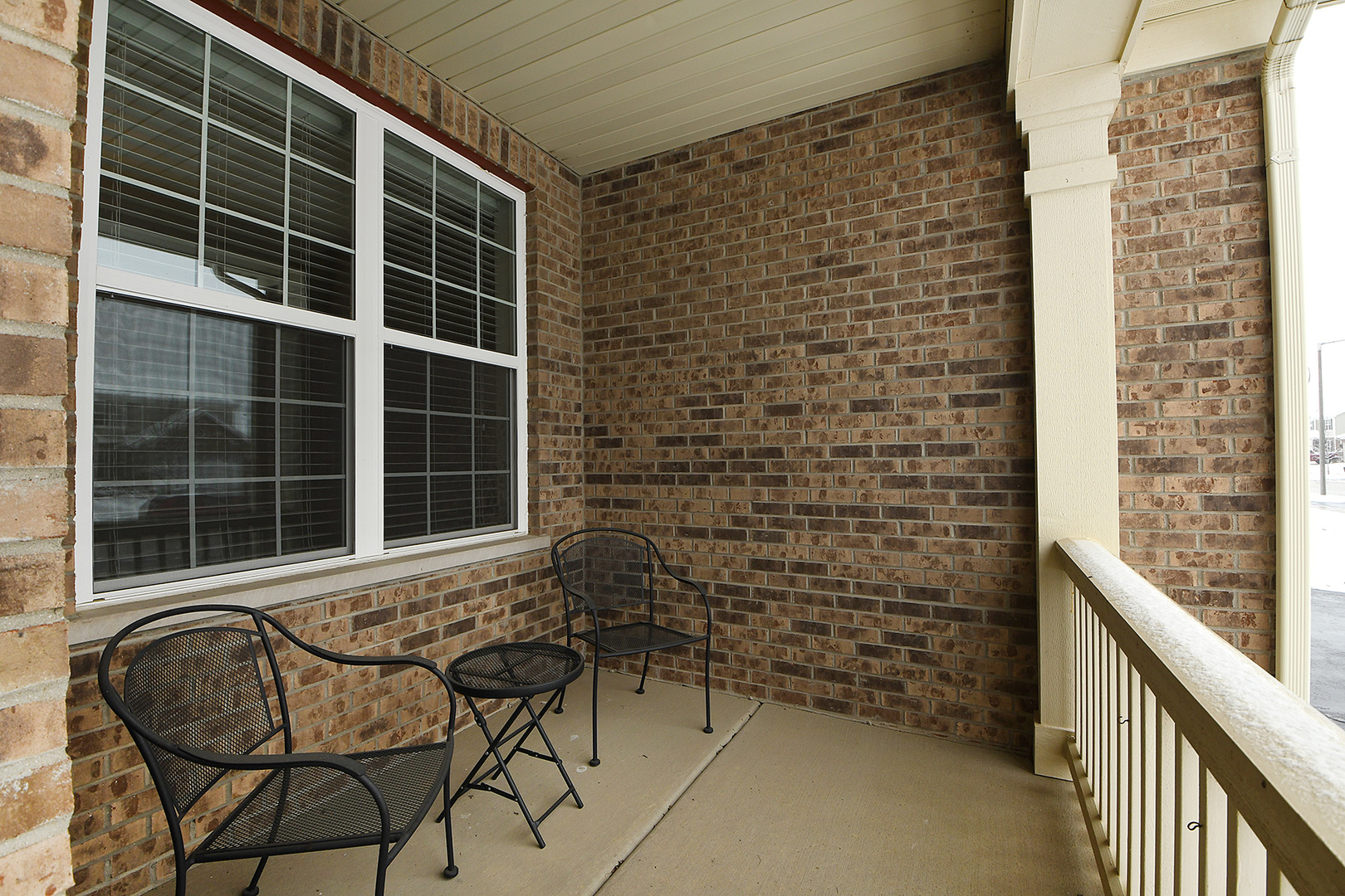 2073 Rownham Hill Road New Lenox, IL 60451 - Photo 2 of 34 a view of a chair and table in the balcony