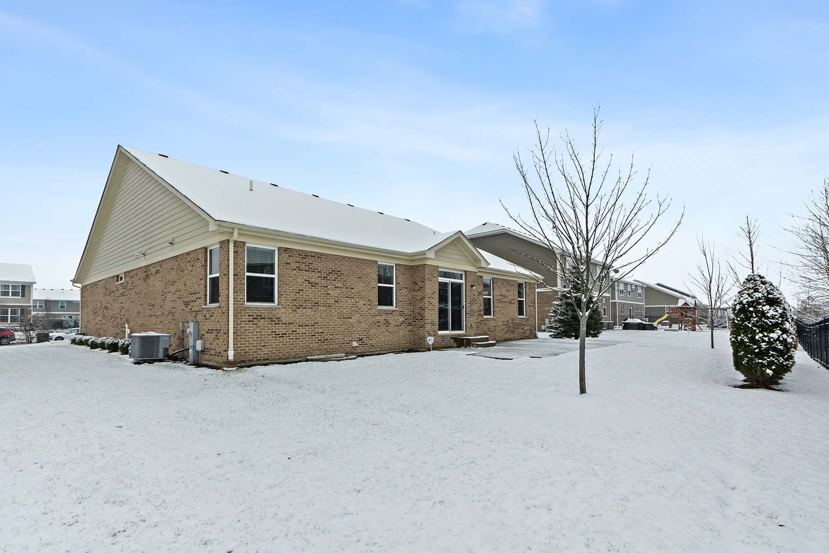 2073 Rownham Hill Road New Lenox, IL 60451 - Photo 27 of 34 a view of a house with a yard and garage