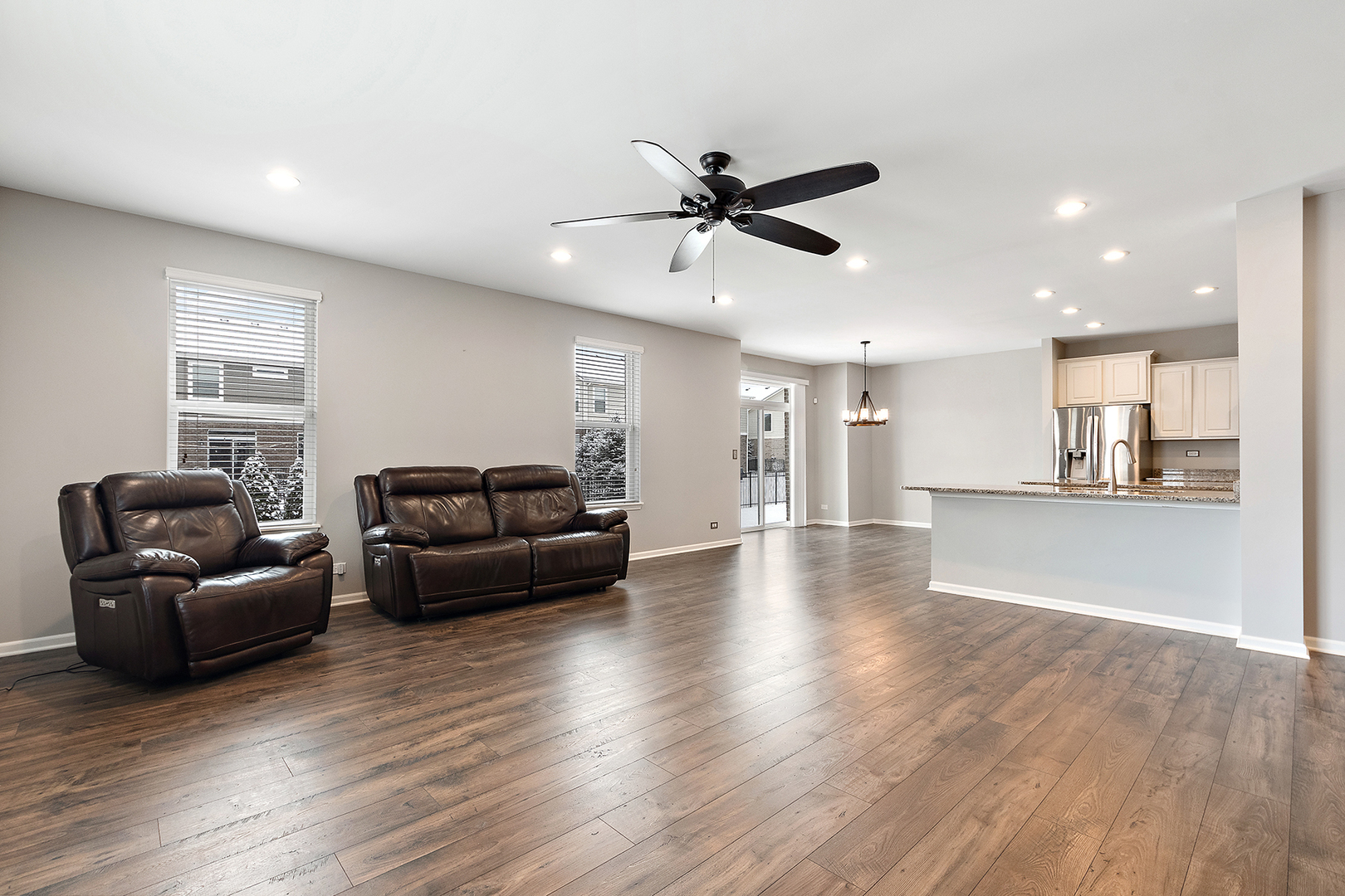 2073 Rownham Hill Road New Lenox, IL 60451 - Photo 8 of 34 a living room with furniture and a view of kitchen