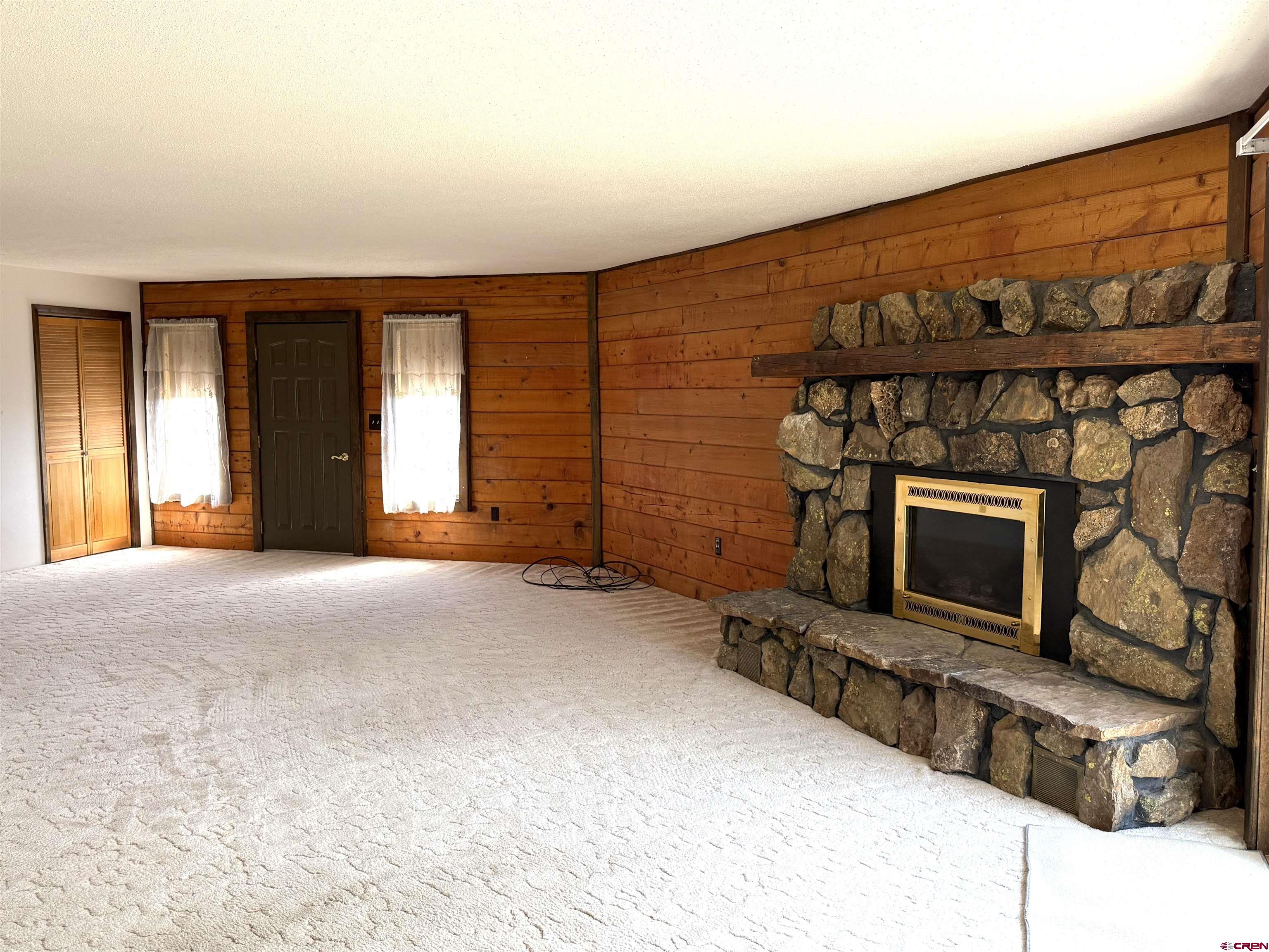 24816 Rd M.3 Cortez, CO 81321 - Photo 13 of 34 a view of a fireplace with windows
