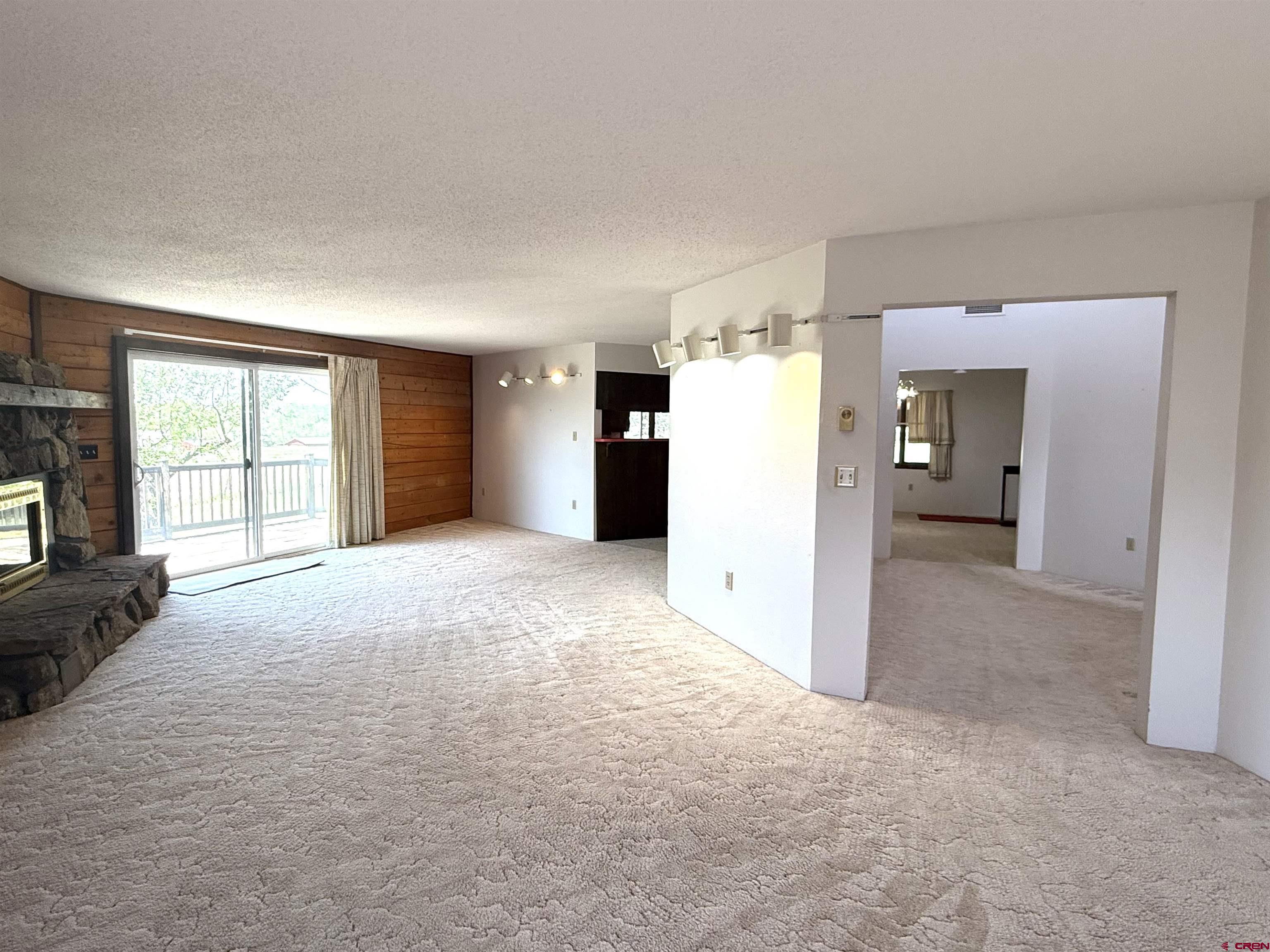 24816 Rd M.3 Cortez, CO 81321 - Photo 14 of 34 an empty room with a window and fire place